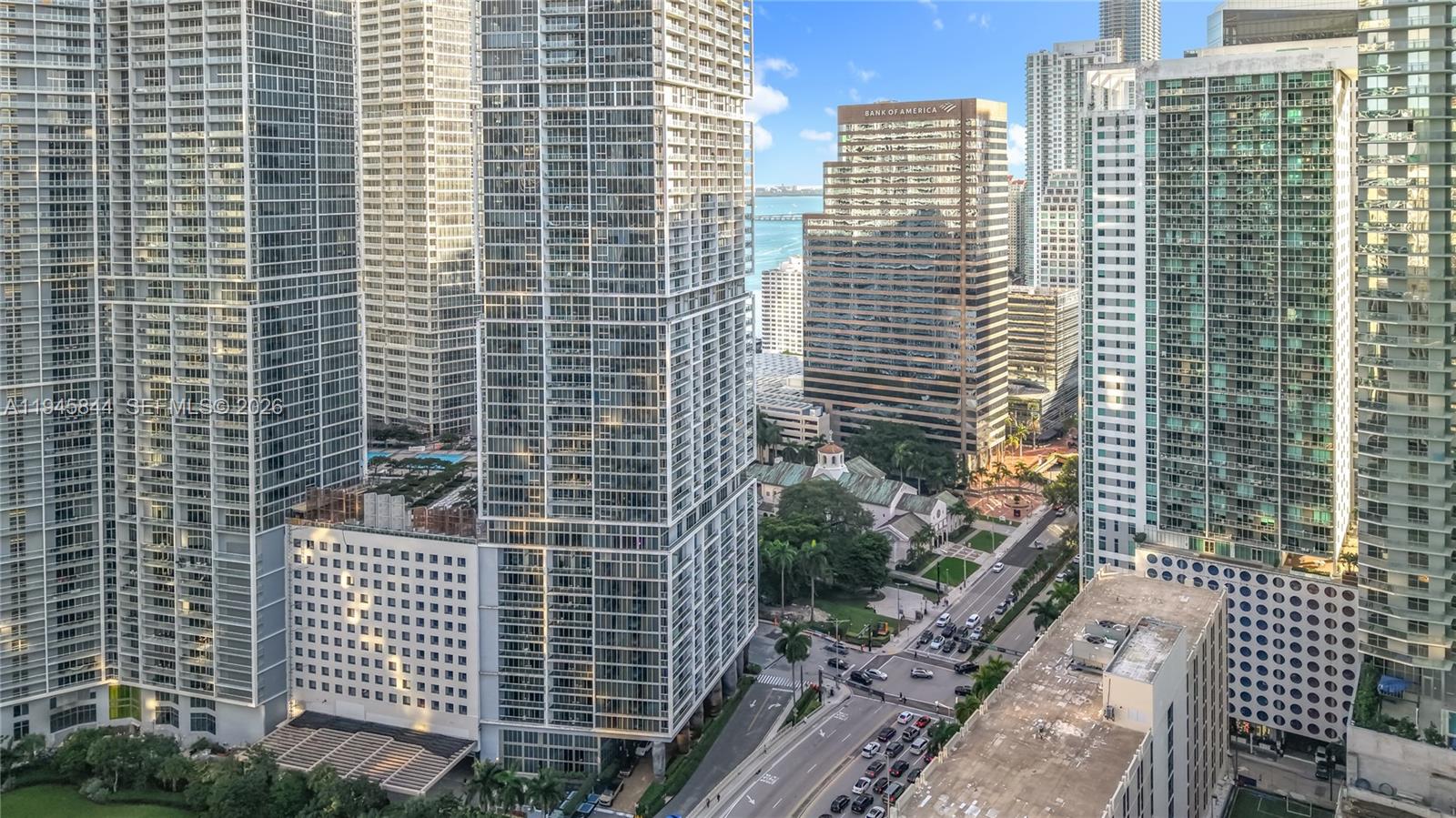 An elevated view of a dense urban area featuring multiple glass skyscrapers and a street — 475 Brickell Ave # 4215, Miami FL 33131, MIAMI, FL