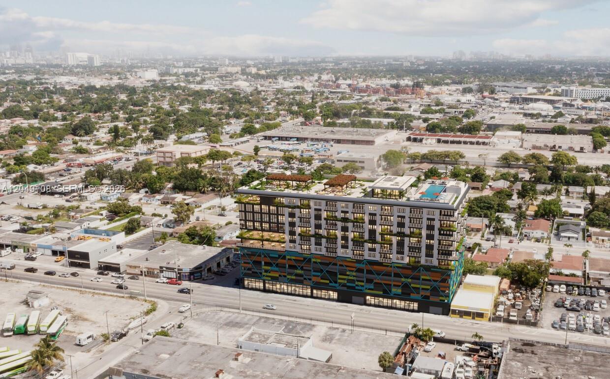 This is a rendering of a modern mid-rise building with a colorful parking garage base — MIAMI, FL