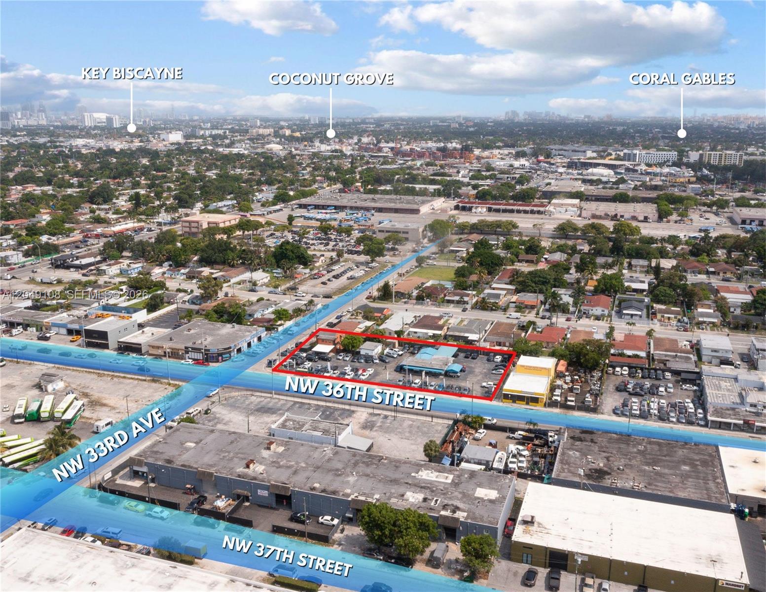 An aerial view shows a commercial property outlined in red along a city street — MIAMI, FL