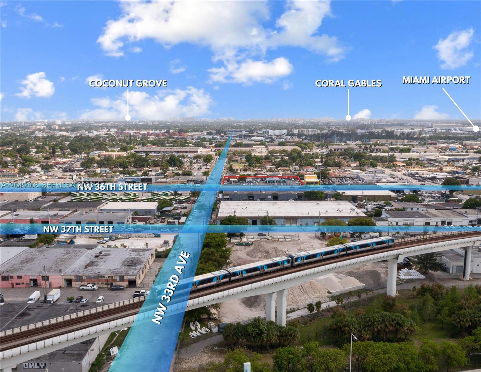 This aerial map shows a train on an elevated track crossing over city streets — MIAMI, FL