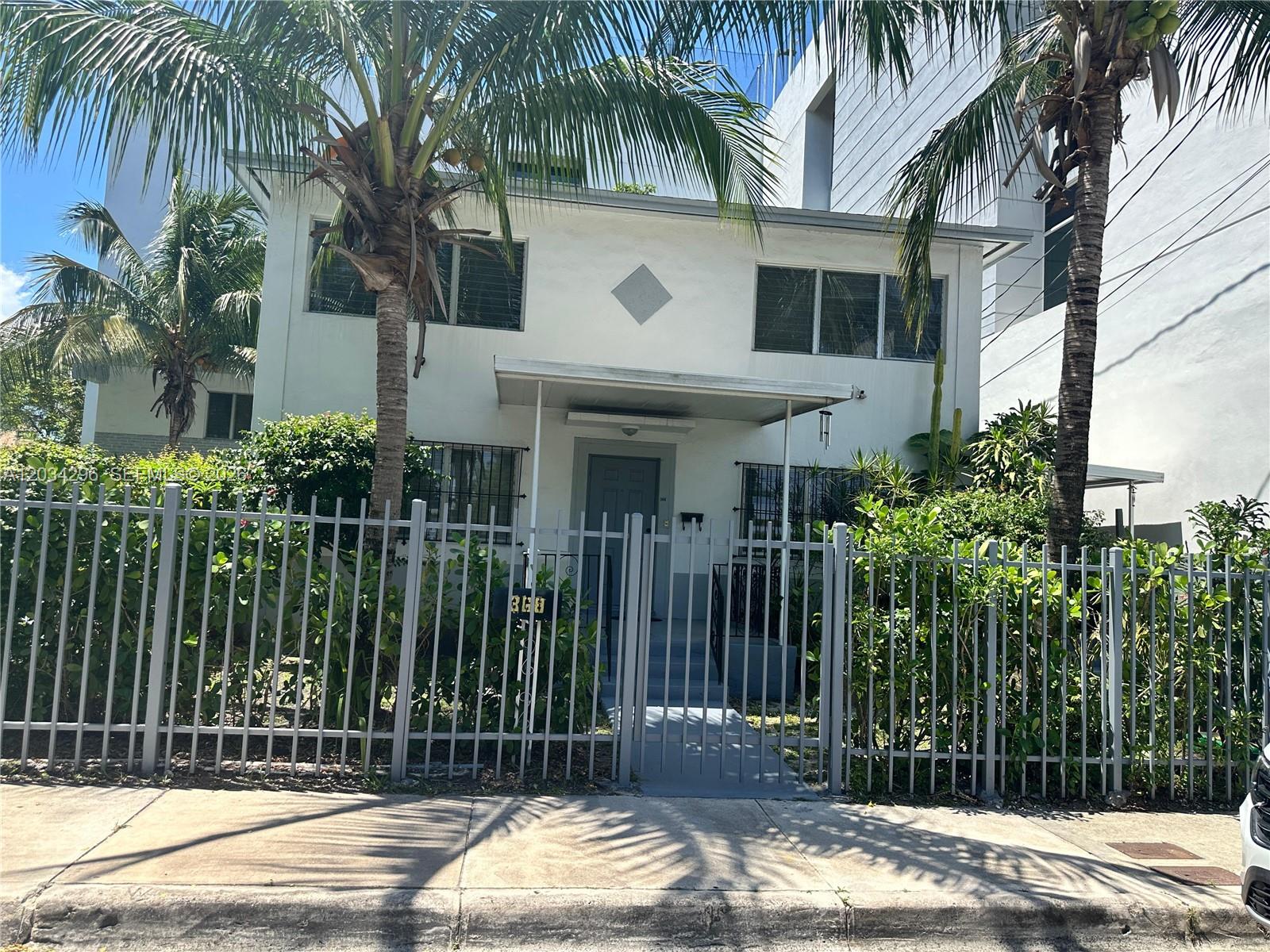 A two-story white house with a fenced front yard and palm trees — 364 SW 11th St, Miami FL 33130, MIAMI, FL