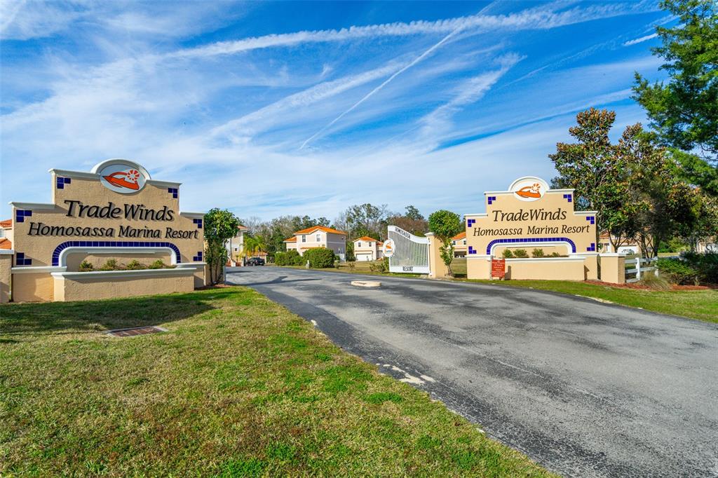 The entrance to the TradeWinds Homosassa Marina Resort features two matching signs and a gate — 10228 W MIDDLEBURG LOOP, HOMOSASSA, FL