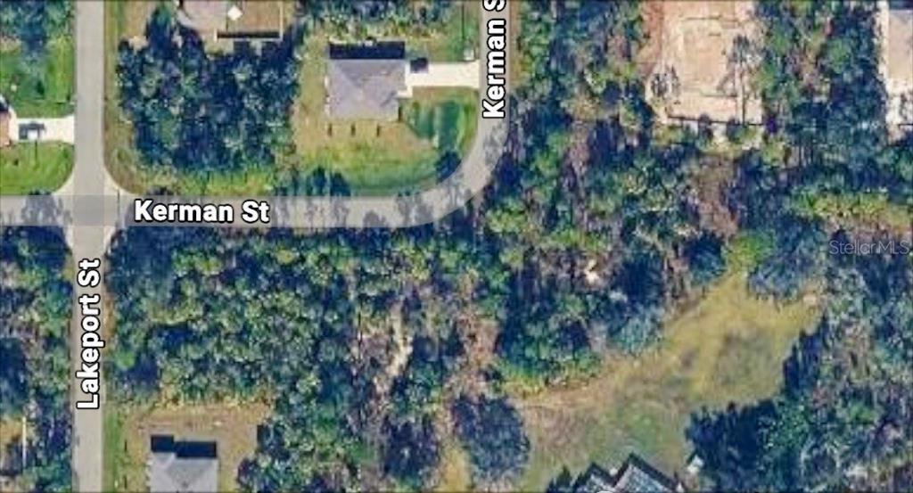 This aerial map shows a residential street corner with wooded lots and nearby houses — KERMAN STREET, NORTH PORT, FL
