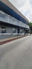 A two-story building with a gray exterior, a white balcony railing, and a paved street — 4853 NW 9th Dr # 4853, Plantation FL 33317, PLANTATION, FL