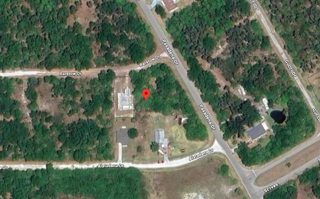 This is an aerial map view of a vacant lot marked with a red pin — 28255 BARSTOW DRIVE, PUNTA GORDA, FL