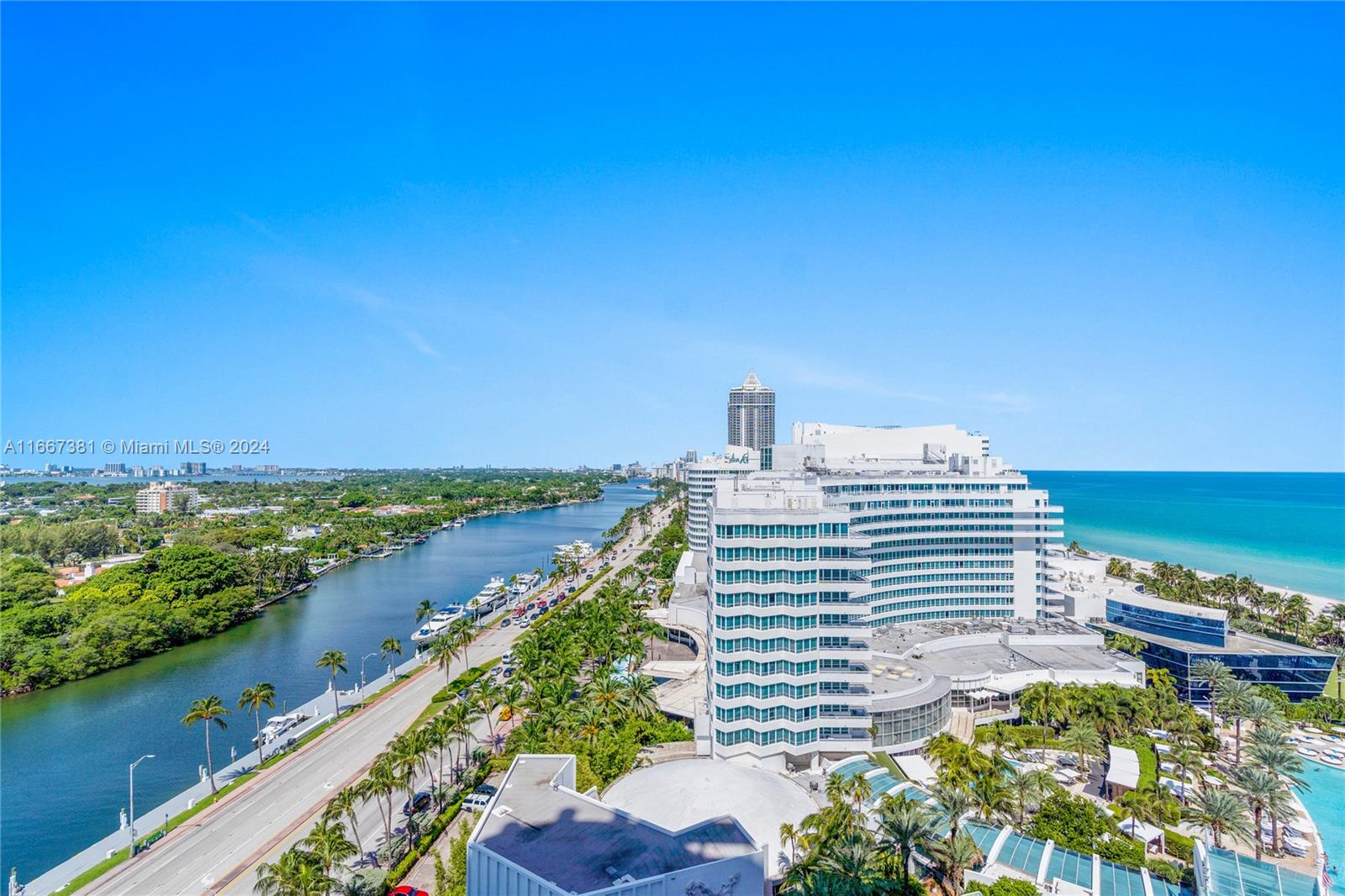 An aerial view shows a coastal hotel, a waterway, a road, and the ocean — 4401 Collins Ave # 1709, Miami Beach FL 33140, MIAMI BEACH, FL