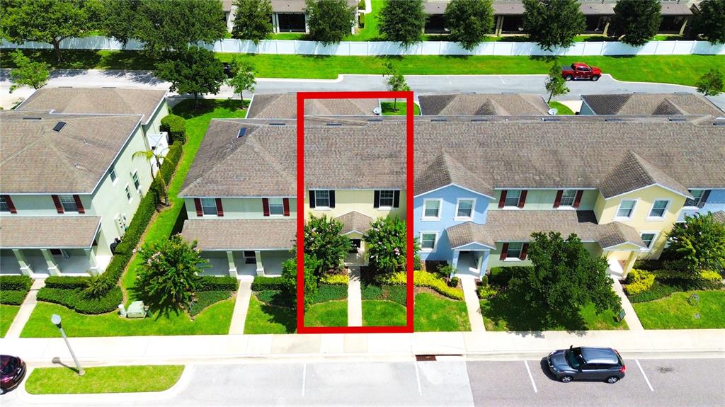 An aerial view shows a townhome unit highlighted in red within a residential complex — 1217 SEBURN ROAD, APOPKA, FL