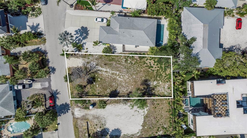 This is an architectural rendering showing the front and rear exterior perspectives of a house — 243 COOLIDGE DRIVE, SARASOTA, FL