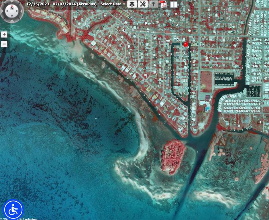 This is an aerial map view of a coastal residential neighborhood with a canal system — 409 BRYN MAWR ISLAND, BRADENTON, FL