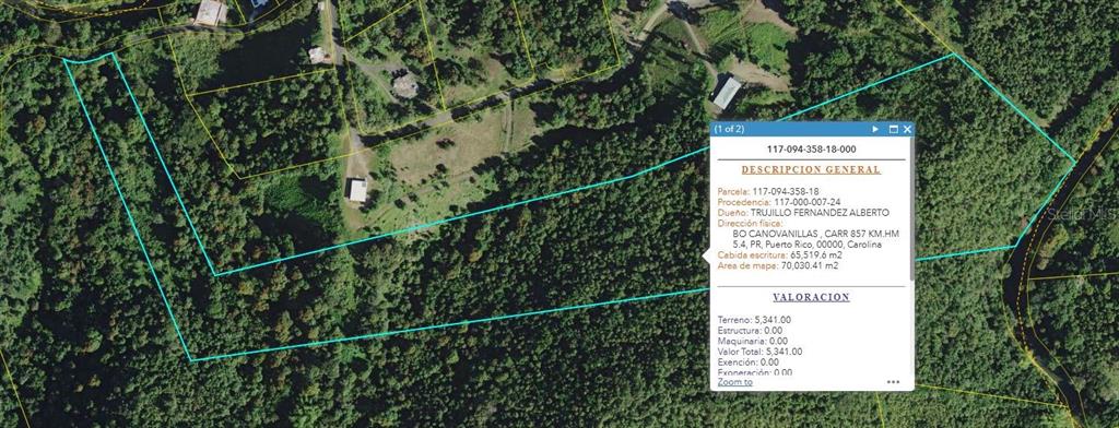 An aerial map view shows a large, irregularly shaped plot of land outlined in blue — 857 KM 5.2, CAROLINA, PR
