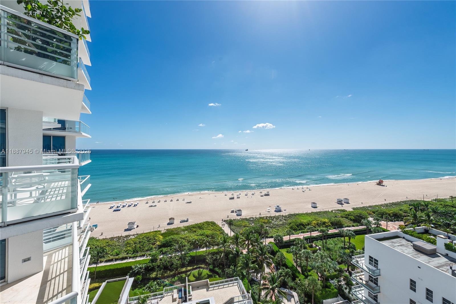 An elevated view from a balcony overlooking a sandy beach and the ocean — 3801 Collins Ave # 1502, Miami Beach FL 33140, MIAMI BEACH, FL
