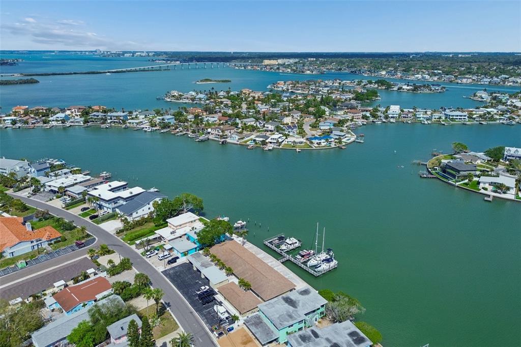 An aerial view of a waterfront residential neighborhood with a boat dock and bridge — 2307 BAY BOULEVARD, INDIAN ROCKS BEACH, FL