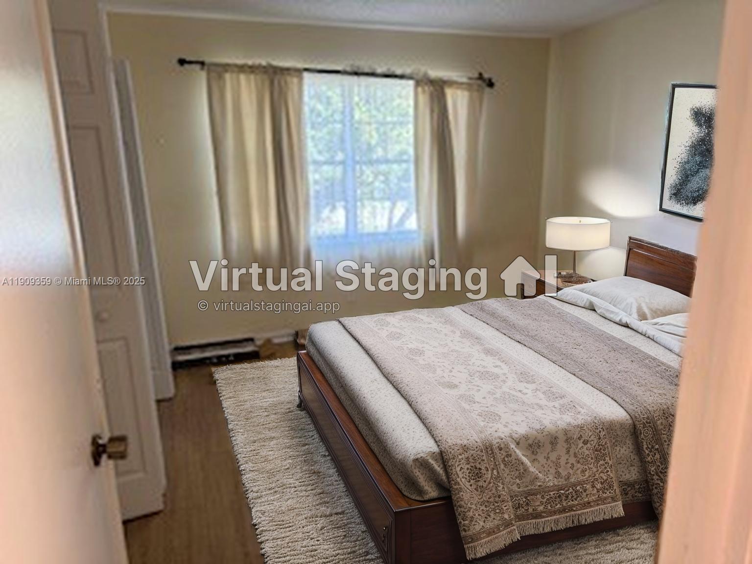 This bedroom features a bed with a patterned cover, a rug, and a window — 8411 NW 8th St # 203, Miami FL 33126, MIAMI, FL