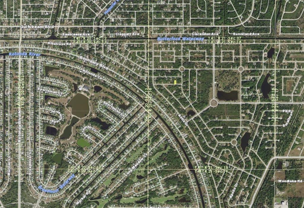 This is an aerial map showing residential streets, waterways, and property boundaries in a neighborhood — 128 LANTANA ROAD, ROTONDA WEST, FL