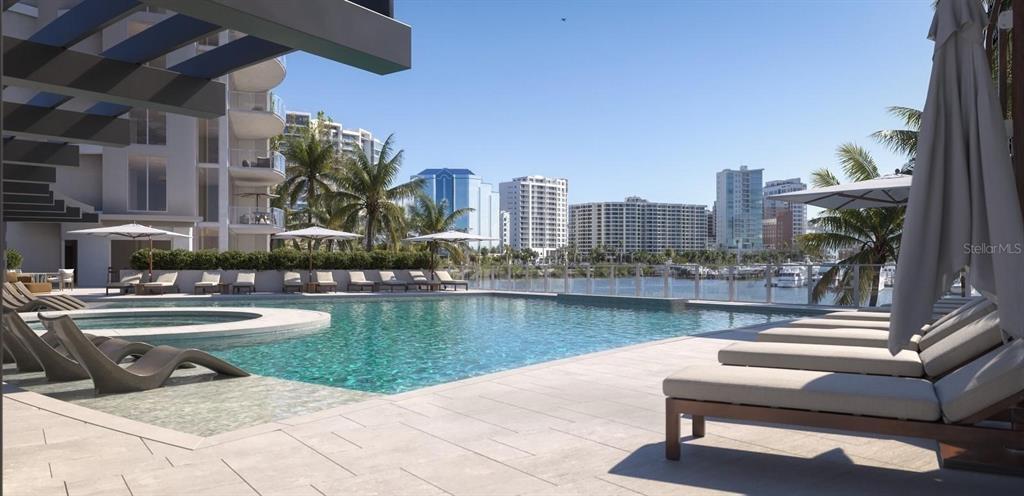 This is a rendering of a luxury apartment complex swimming pool overlooking a city waterfront — 550 GOLDEN GATE POINT UNIT 503, SARASOTA, FL