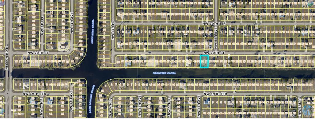 This is a satellite map showing a residential neighborhood with a highlighted vacant lot — 504 NW 20TH STREET, CAPE CORAL, FL