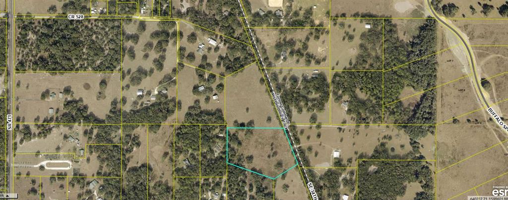 This is an aerial map showing a parcel of land outlined in blue — 00 SE 34TH WAY, SUMTERVILLE, FL