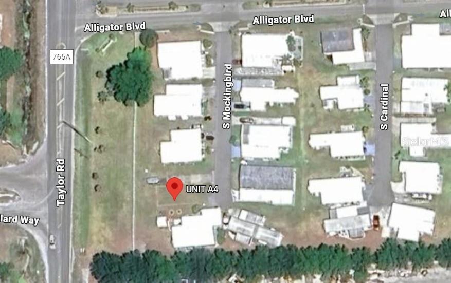 This aerial map shows a residential lot marked as Unit A4 near a road intersection — 6400 TAYLOR ROAD UNIT A4, PUNTA GORDA, FL