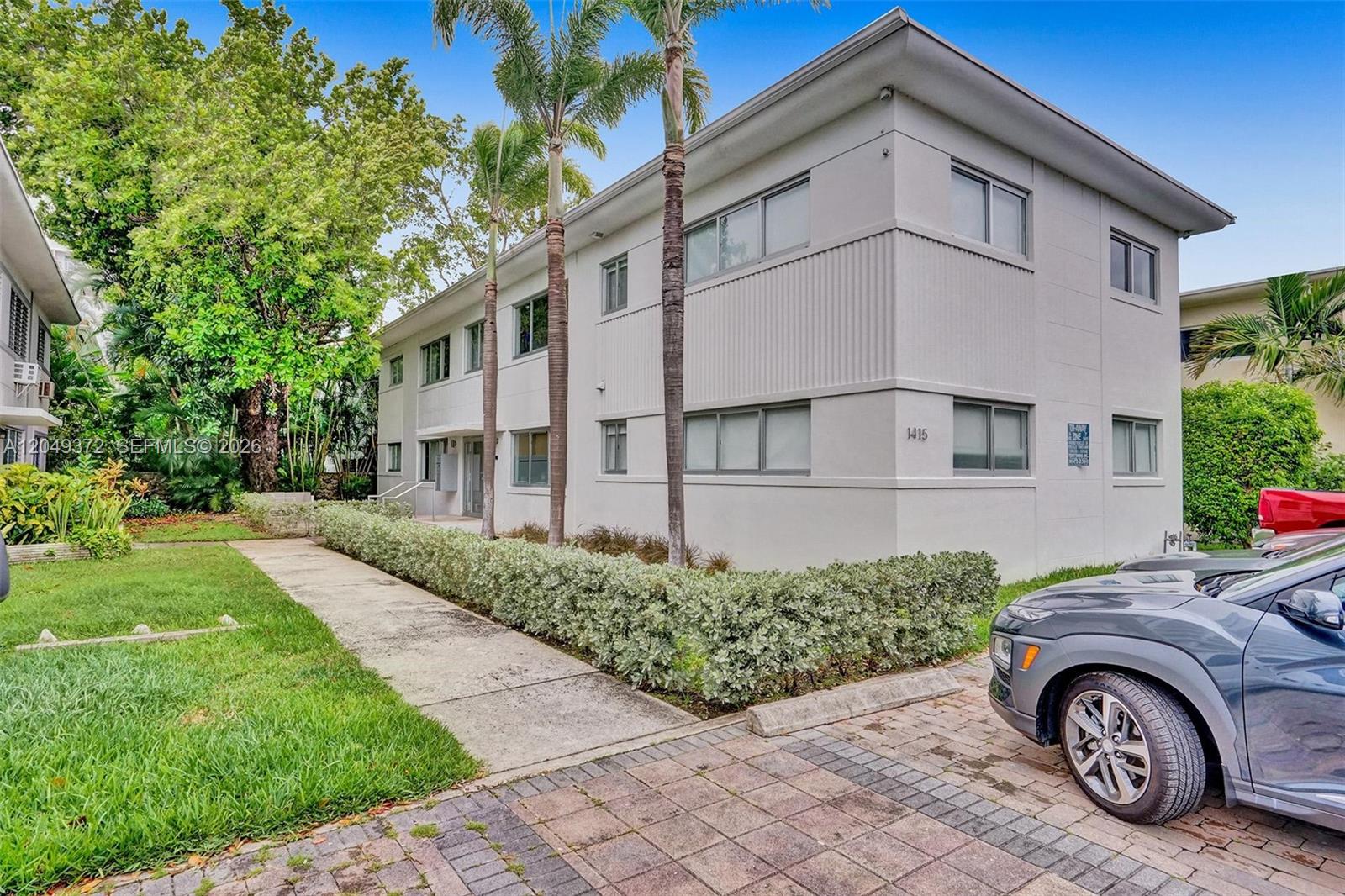 A two-story apartment building with a paved walkway, palm trees, and a parked car — 1415 16th St # 2, Miami Beach FL 33139, MIAMI BEACH, FL