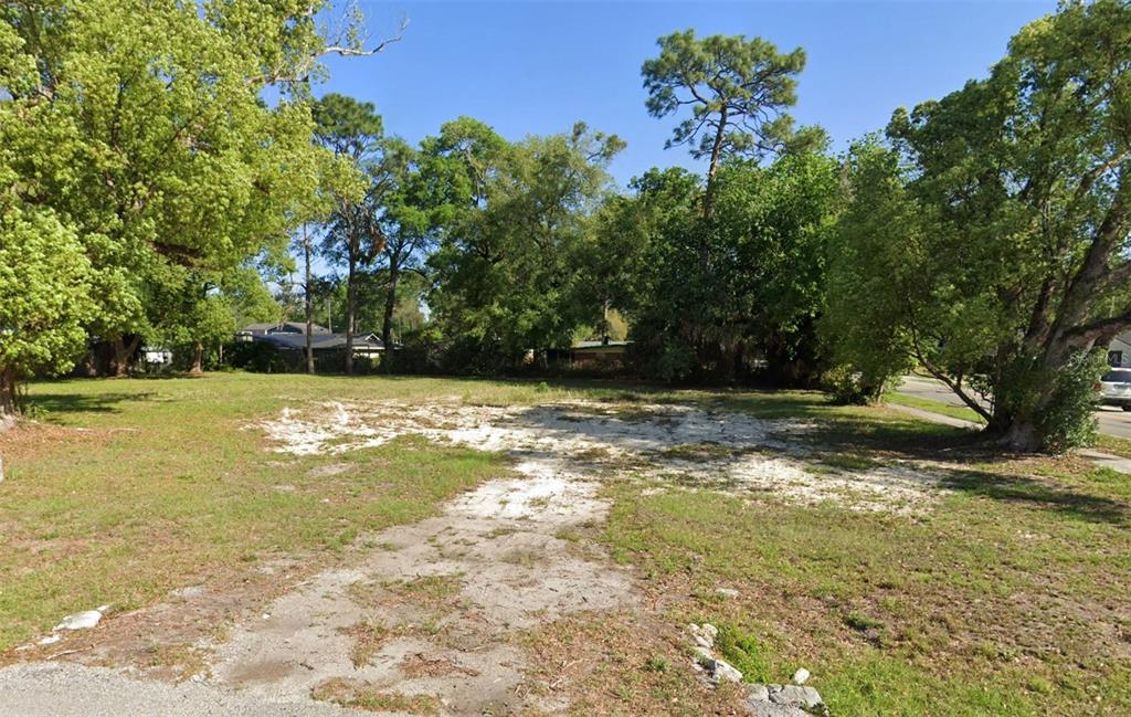 A vacant, grassy residential lot features patches of exposed sand and several mature trees — 1329 FRANKLIN STREET, ALTAMONTE SPRINGS, FL