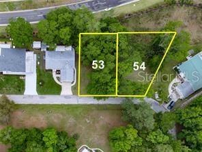 This aerial view shows two adjacent vacant lots marked 53 and 54 in a neighborhood — LOT 52 BLK C LEXINGTON- CIRCLE, WILDWOOD, FL