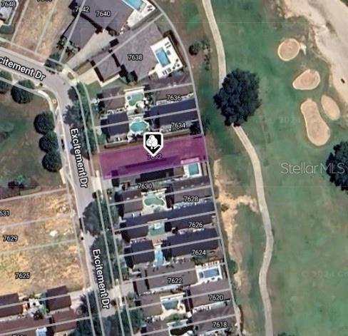 This is an aerial map view of a residential property highlighted in purple — 7632 EXCITEMENT DRIVE, REUNION, FL