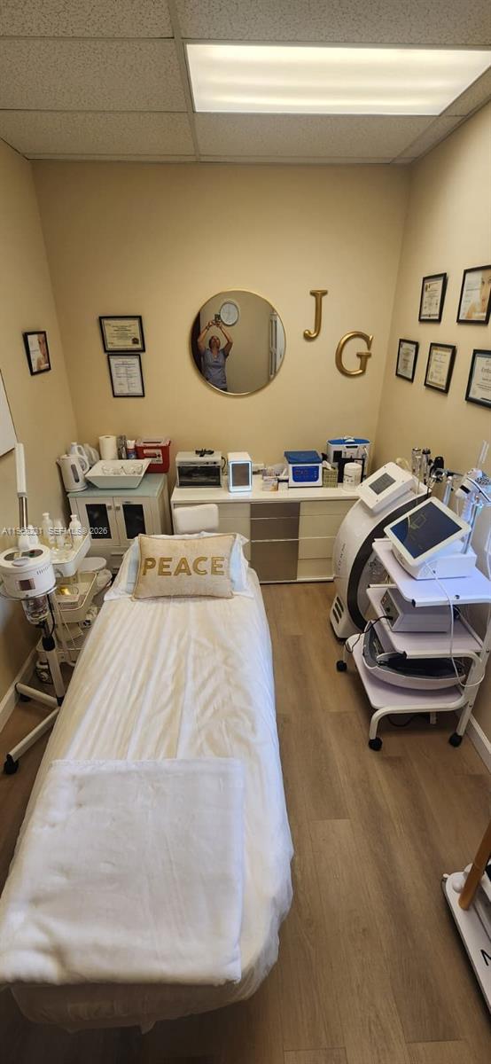 A small treatment room features a massage table, medical equipment, and wall-mounted certificates — orange dr 12505, Davie FL 33330, DAVIE, FL
