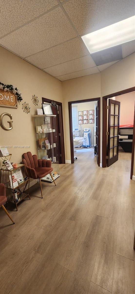 A waiting area leads into two treatment rooms with wood-look flooring and drop ceilings — orange dr 12505, Davie FL 33330, DAVIE, FL