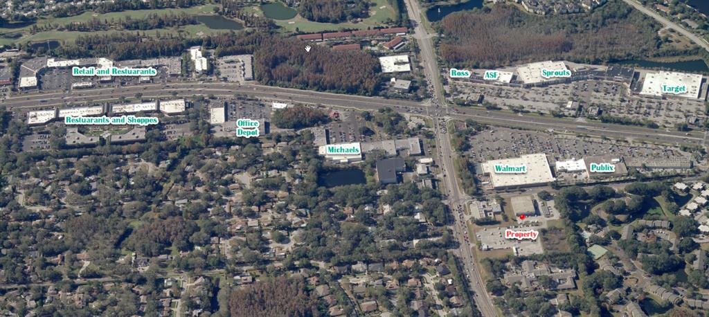 An aerial view shows a commercial property location surrounded by retail stores and residential neighborhoods — 3603 W BEARSS AVENUE, TAMPA, FL