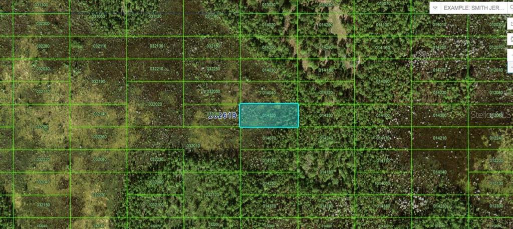 This is a map showing a highlighted rectangular land parcel outlined in blue — OLD GRADE RD, POLK CITY, FL