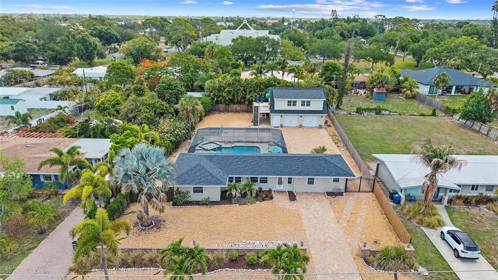 An aerial view shows a single-story house with a pool enclosure and a detached garage — 6139 HOLLYWOOD BOULEVARD, SARASOTA, FL
