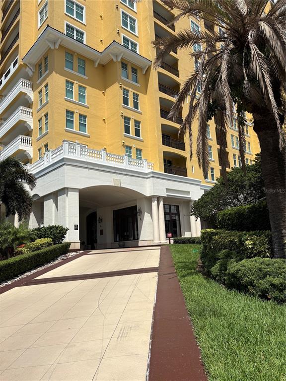A covered hotel entrance features a tiered stone fountain and a patterned paved driveway — 345 BAYSHORE BOULEVARD UNIT 403, TAMPA, FL