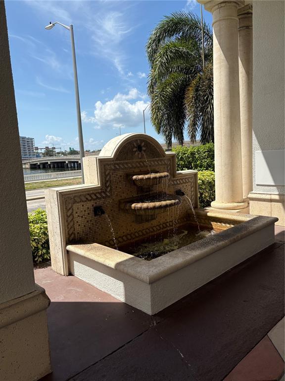 A view from a balcony overlooking a large building and a waterway with palm trees — 345 BAYSHORE BOULEVARD UNIT 403, TAMPA, FL