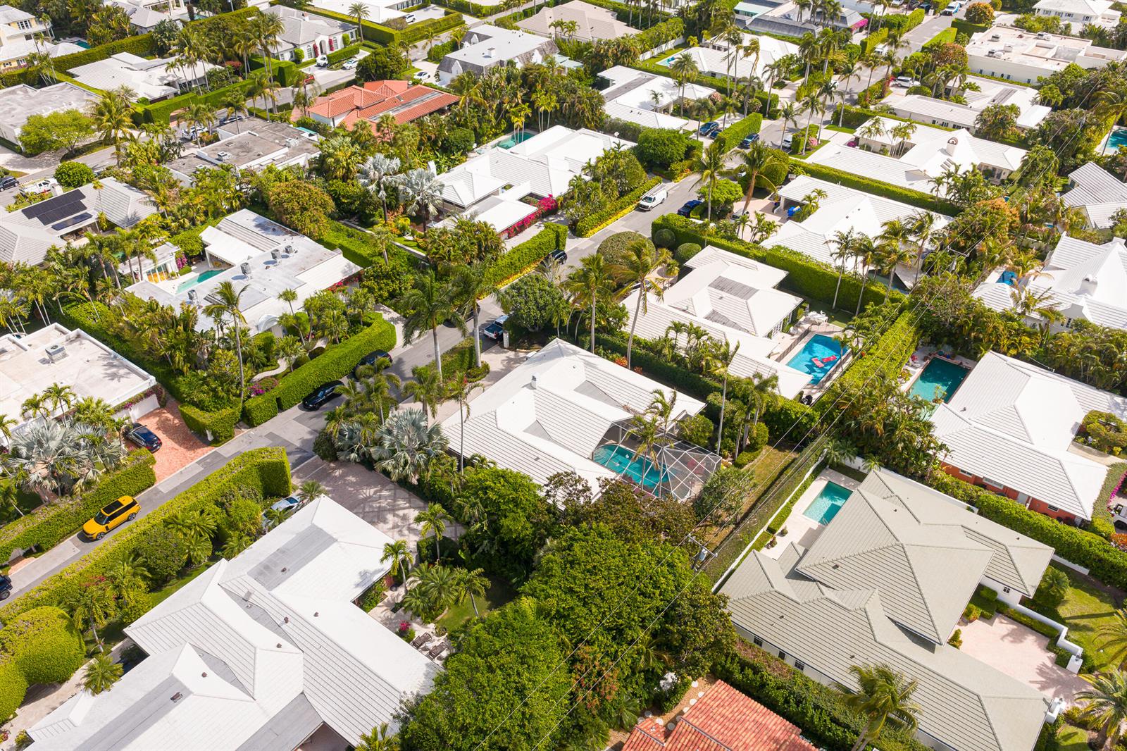 An aerial view of a residential neighborhood featuring houses with white roofs and swimming pools — 280 Tradewind Drive, Palm Beach FL 33480, PALM BEACH, FL