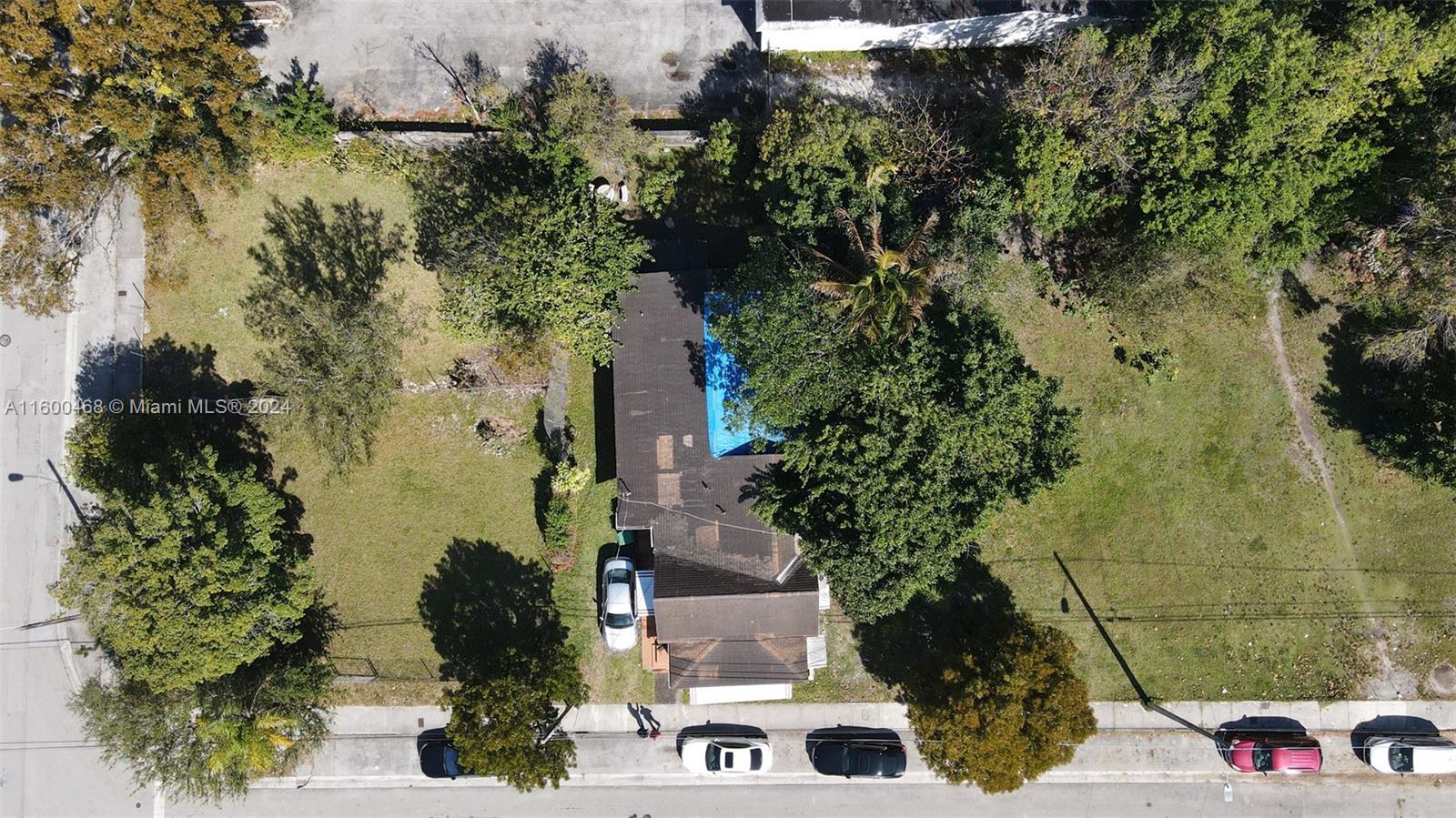 An aerial view shows a house with a pool and a large yard — 3373 Thomas Ave, Miami FL 33133, MIAMI, FL
