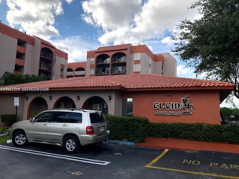 A silver SUV is parked in front of the El Cid Condominiums building — 5201 NW 7th St # 314, Miami FL 33126, MIAMI, FL