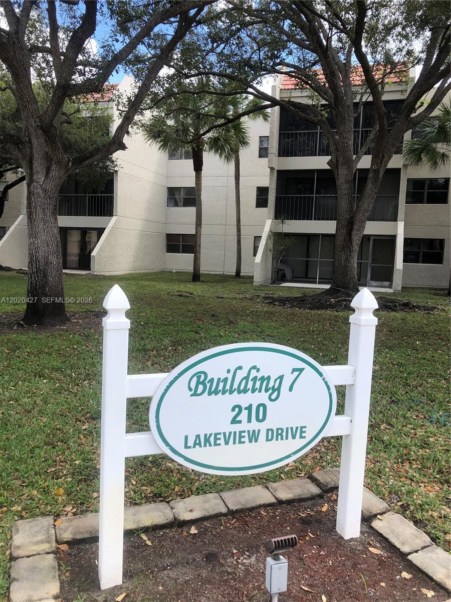 A white sign identifies Building 7 in front of a multi-story apartment complex — 210 Lakeview Dr # 207, Weston FL 33326, WESTON, FL