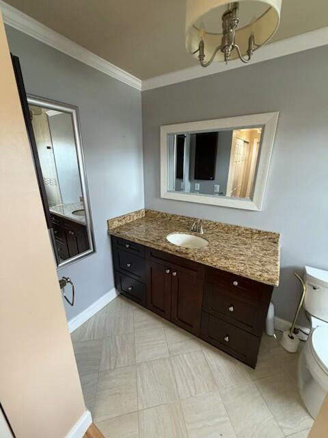 A bathroom features a dark wood vanity with a granite countertop and a wall mirror — 23153 SW 53rd Avenue, Boca Raton FL 33433, BOCA RATON, FL