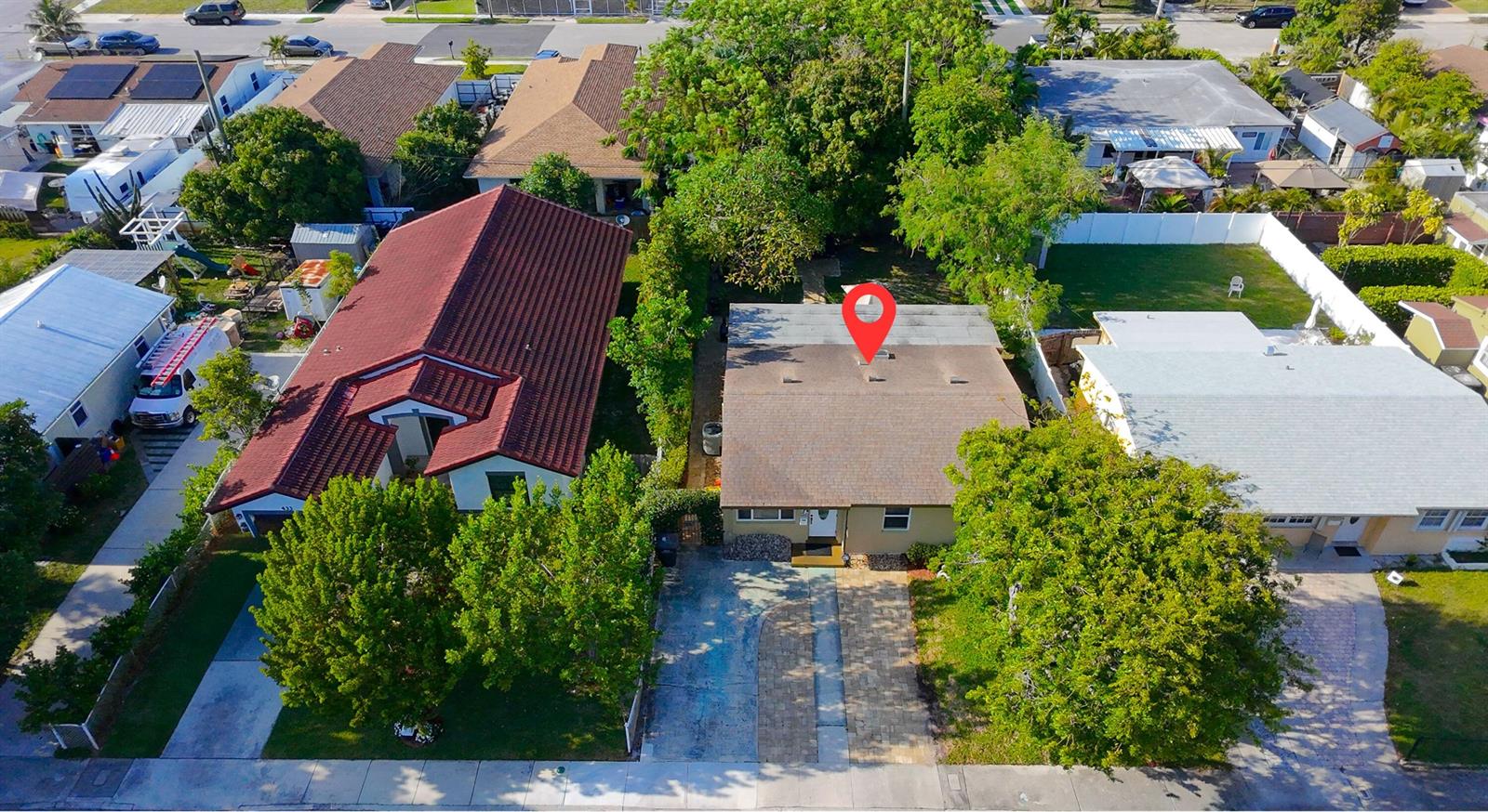 An aerial view shows a single-story house with a brown roof and a red-roofed neighbor — 429 Summa Street, West Palm Beach FL 33405, WEST PALM BEACH, FL