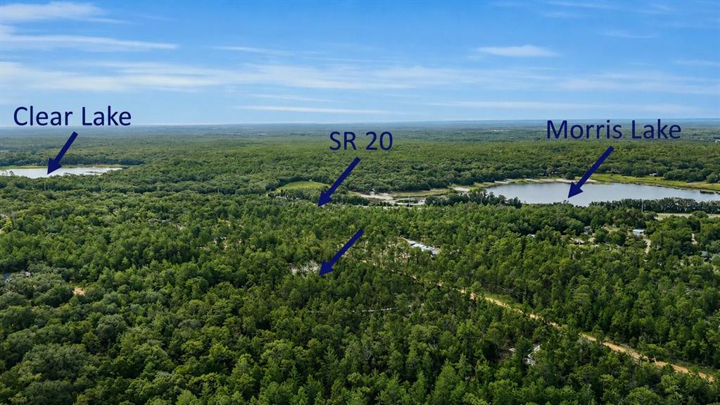 An aerial view shows a wooded landscape with two lakes and a highway — 00 UNASSIGNED LOCATION, HAWTHORNE, FL