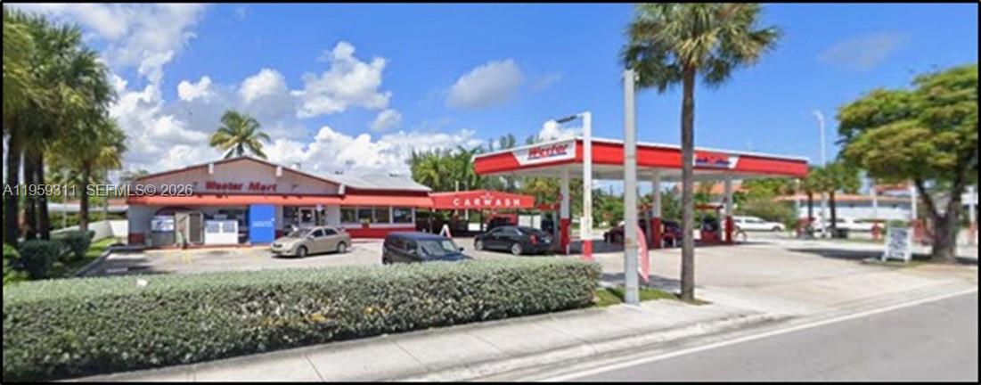 A gas station with a convenience store and car wash under a red canopy — Confidential, North Miami FL 33161, NORTH MIAMI, FL