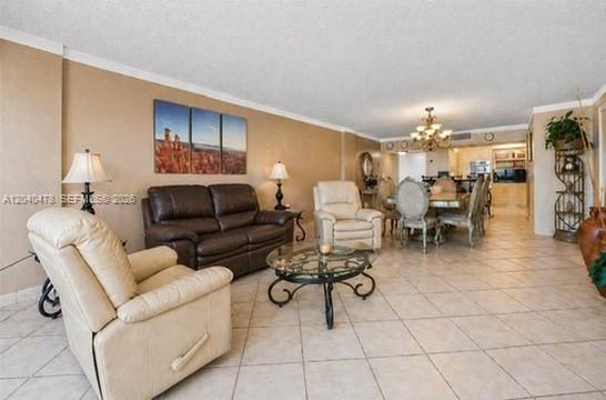 A living room features a beige recliner, a brown leather sofa, and a glass coffee table — 3725 S Ocean Dr # 1124, Hollywood FL 33019, HOLLYWOOD, FL