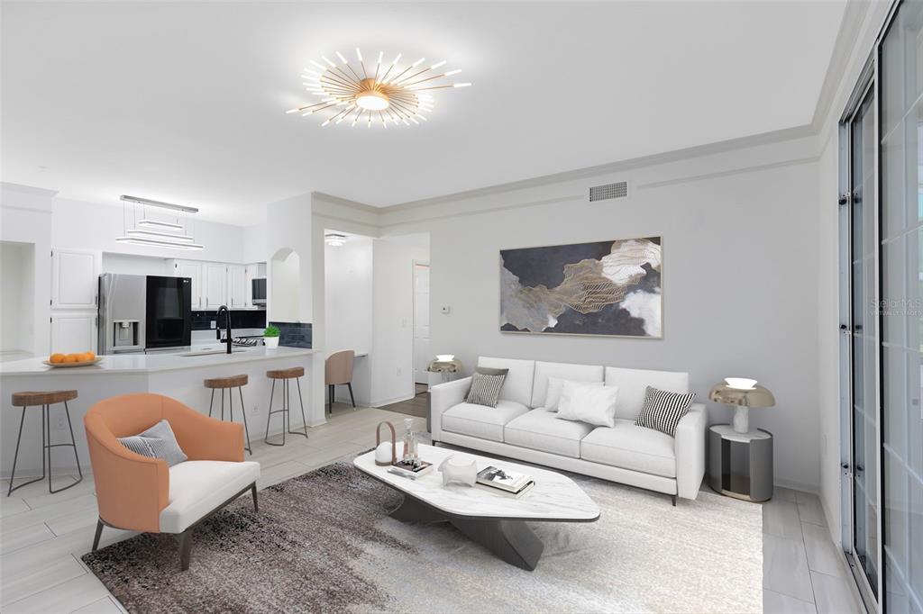 A living room with a white sofa, orange armchair, marble coffee table, and open kitchen — 6685 QUEENS BOROUGH AVENUE UNIT 202, ORLANDO, FL
