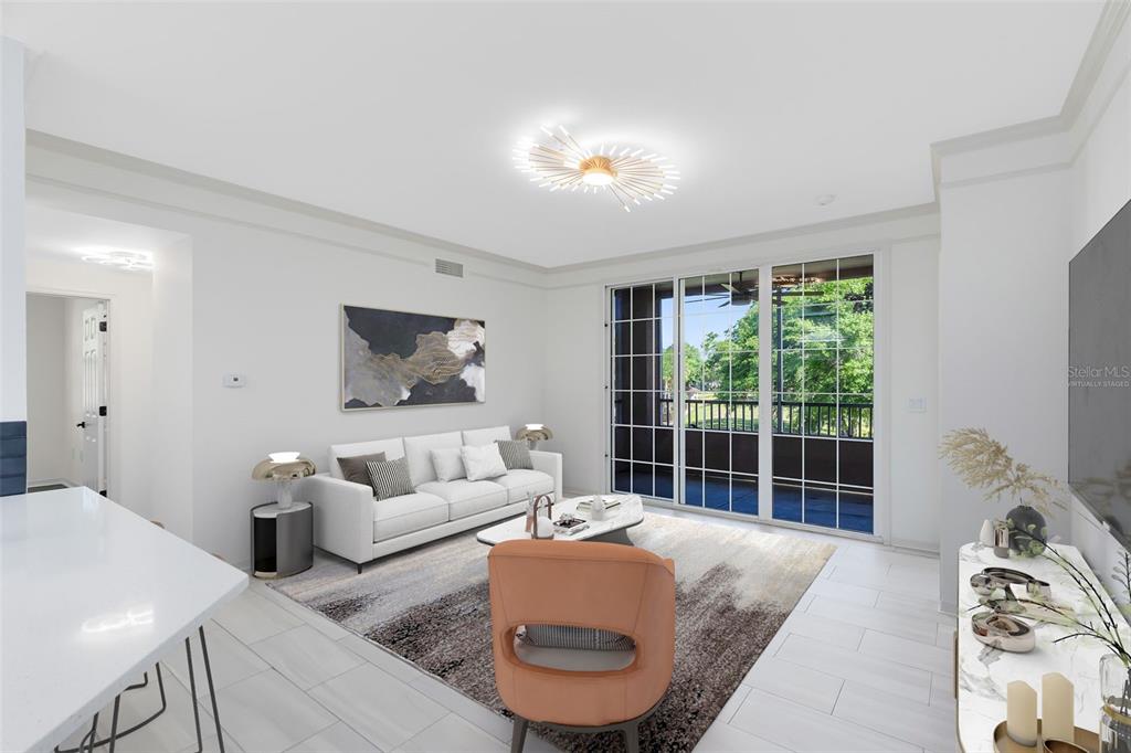 This virtually staged living room features white tile flooring, a modern sofa, and sliding glass doors — 6685 QUEENS BOROUGH AVENUE UNIT 202, ORLANDO, FL