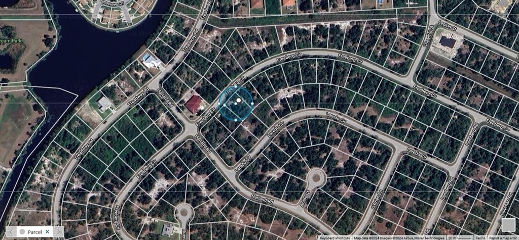 This is a satellite map view of a residential neighborhood with undeveloped wooded lots — 7250 FREEBERG CIRCLE, PORT CHARLOTTE, FL