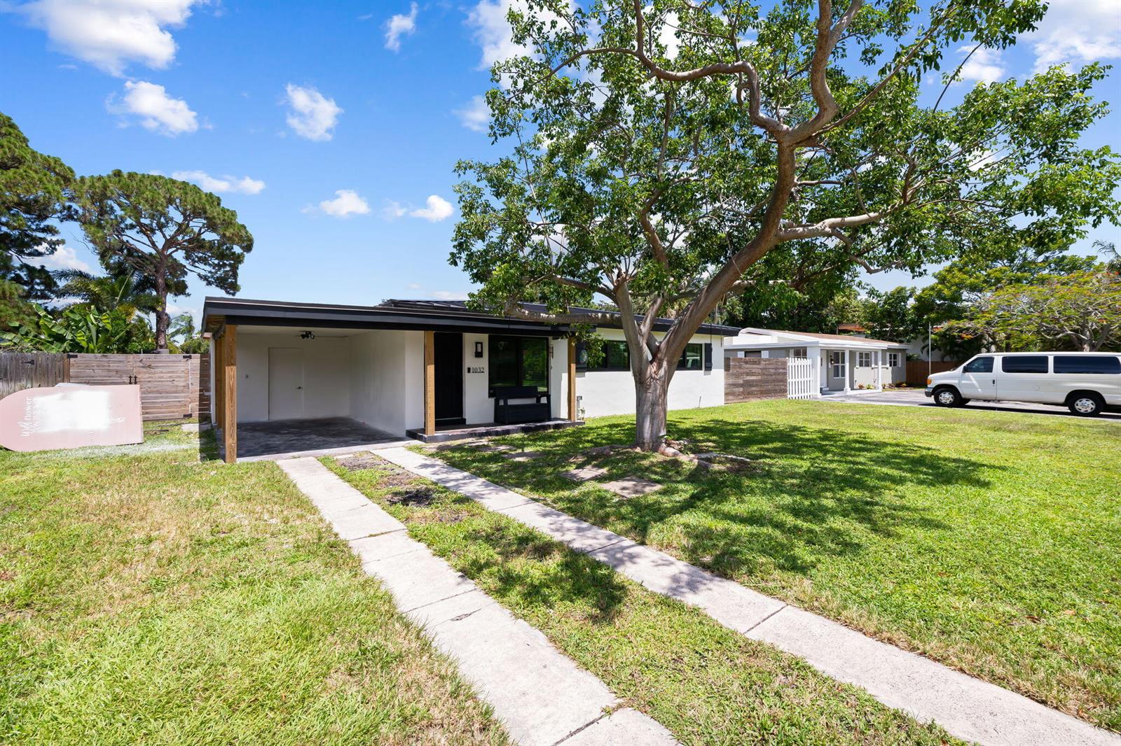 A single-story house with a carport, a large tree, and a concrete driveway — 1032 SW 1st Terrace, Pompano Beach FL 33060, POMPANO BEACH, FL