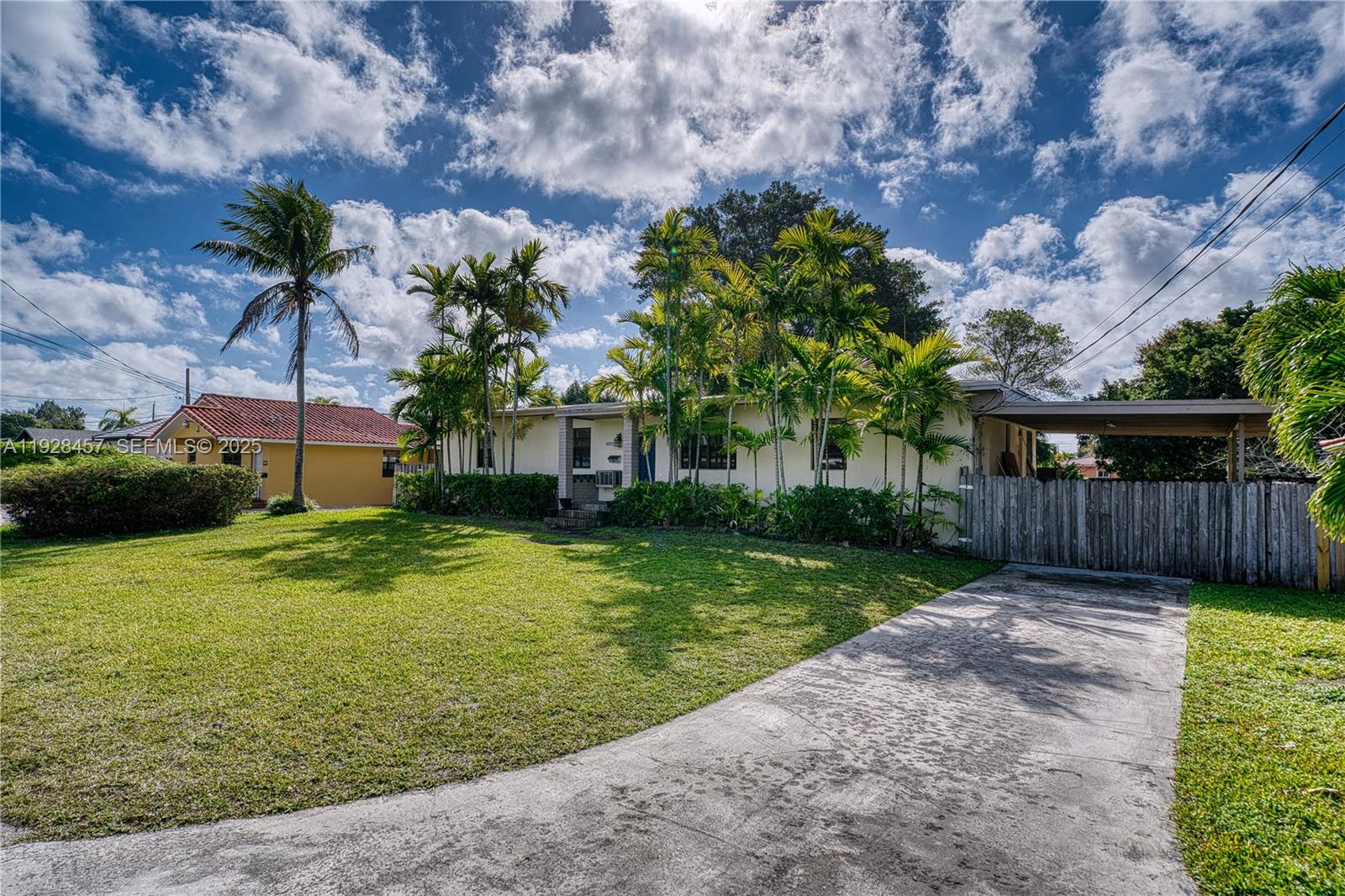 A single-story house with a lawn, palm trees, and a concrete driveway under a sky — 6550 SW 27th St, Miami FL 33155, MIAMI, FL