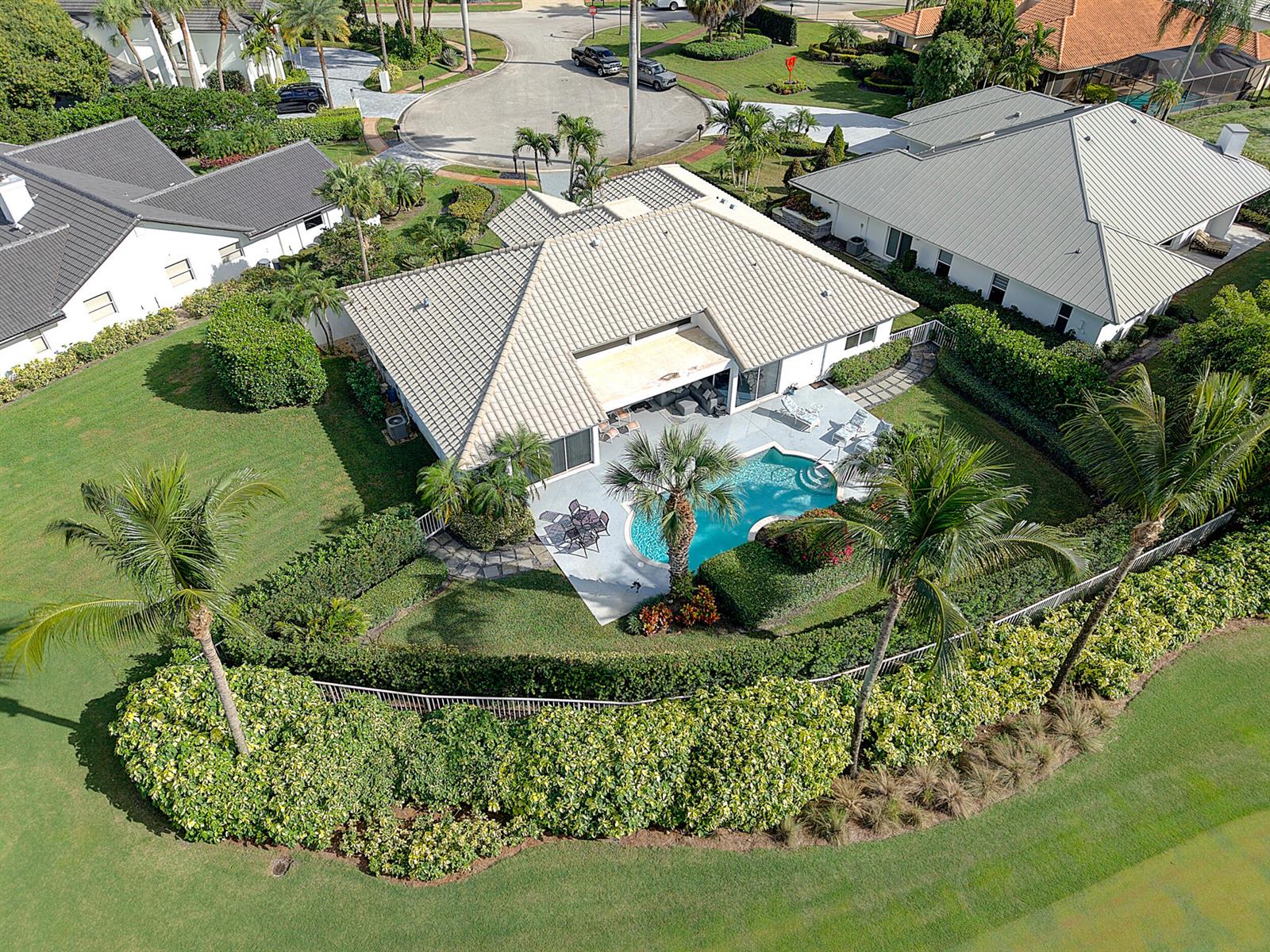 An aerial view of a suburban house with a swimming pool and landscaped backyard — 7946 Shelby Circle, Boca Raton FL 33496, BOCA RATON, FL