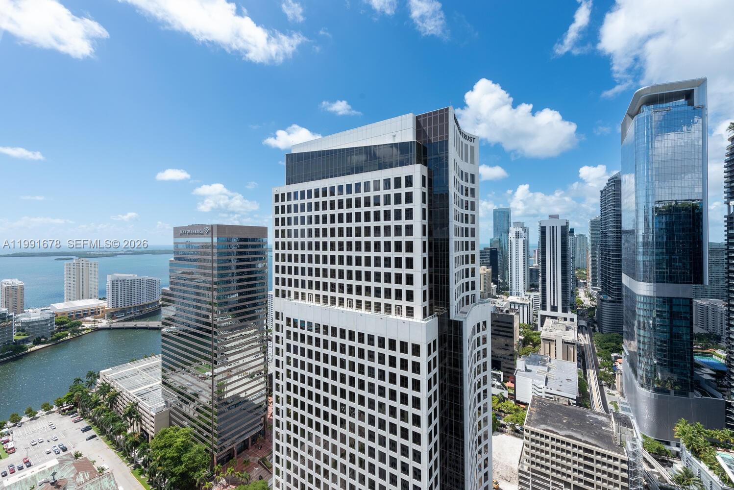An elevated exterior view of several modern skyscrapers in a dense urban waterfront setting — 55 SE 6th St # 4308, Miami FL 33131, MIAMI, FL