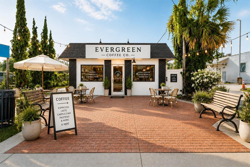 An exterior view of a small coffee shop with a brick patio and outdoor seating — 124 N APOPKA AVENUE, INVERNESS, FL